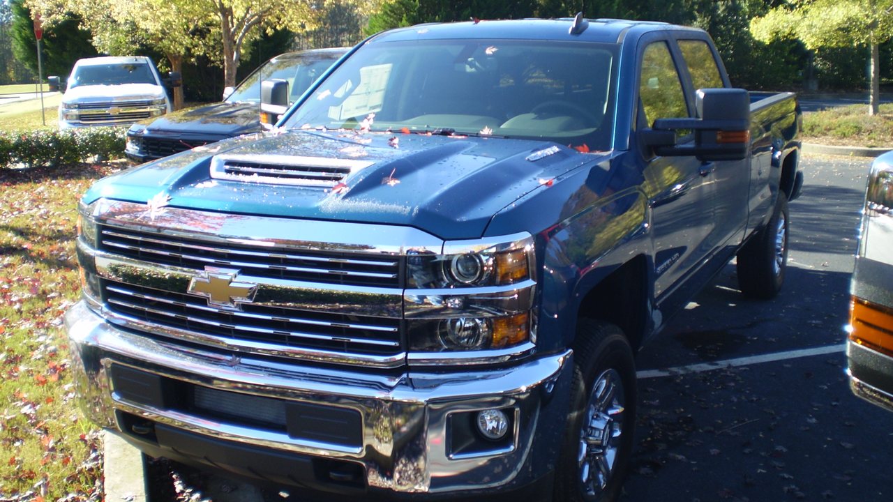 Blue 2018 Chevrolet Silverado 2500HD LT 4WD crew cab with a long bed