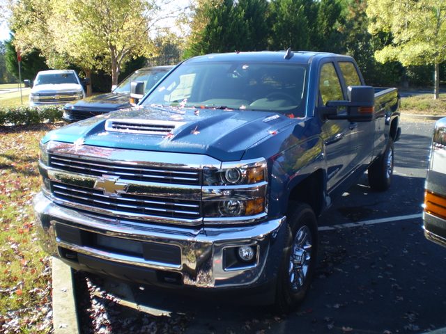 Blue 2018 Chevrolet Silverado 2500HD LT 4WD crew cab with a long bed