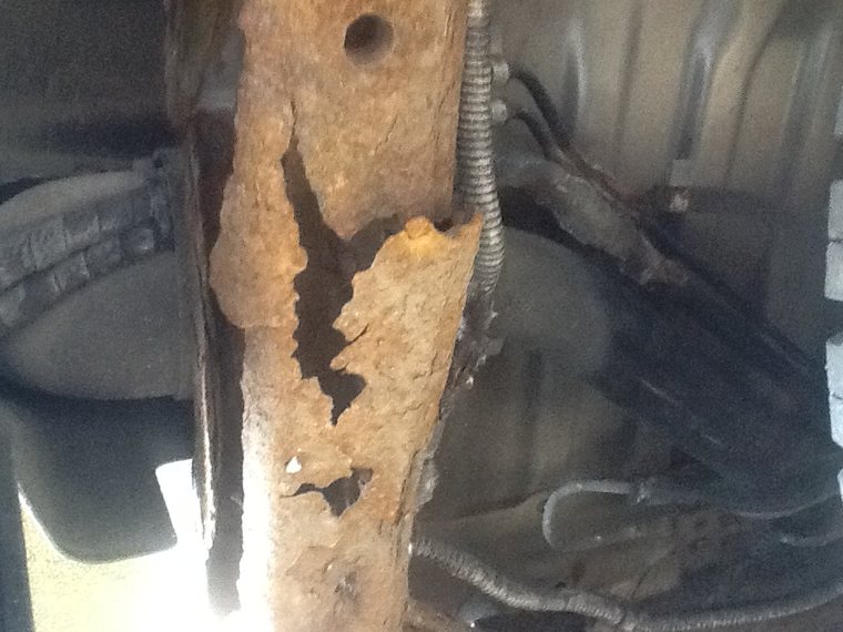 Severe structural frame rust on a Honda Passport